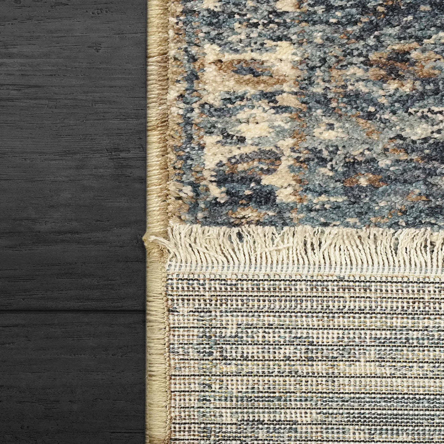 A closeup of a traditional Dakota rectangular rug with a geometric pattern, featuring beige and blue colors.