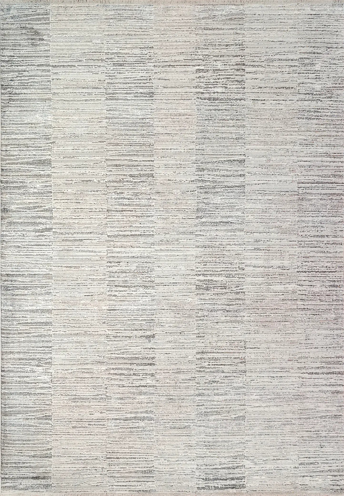 A rectangular rug with a modern abstract geometric pattern in shades of beige.